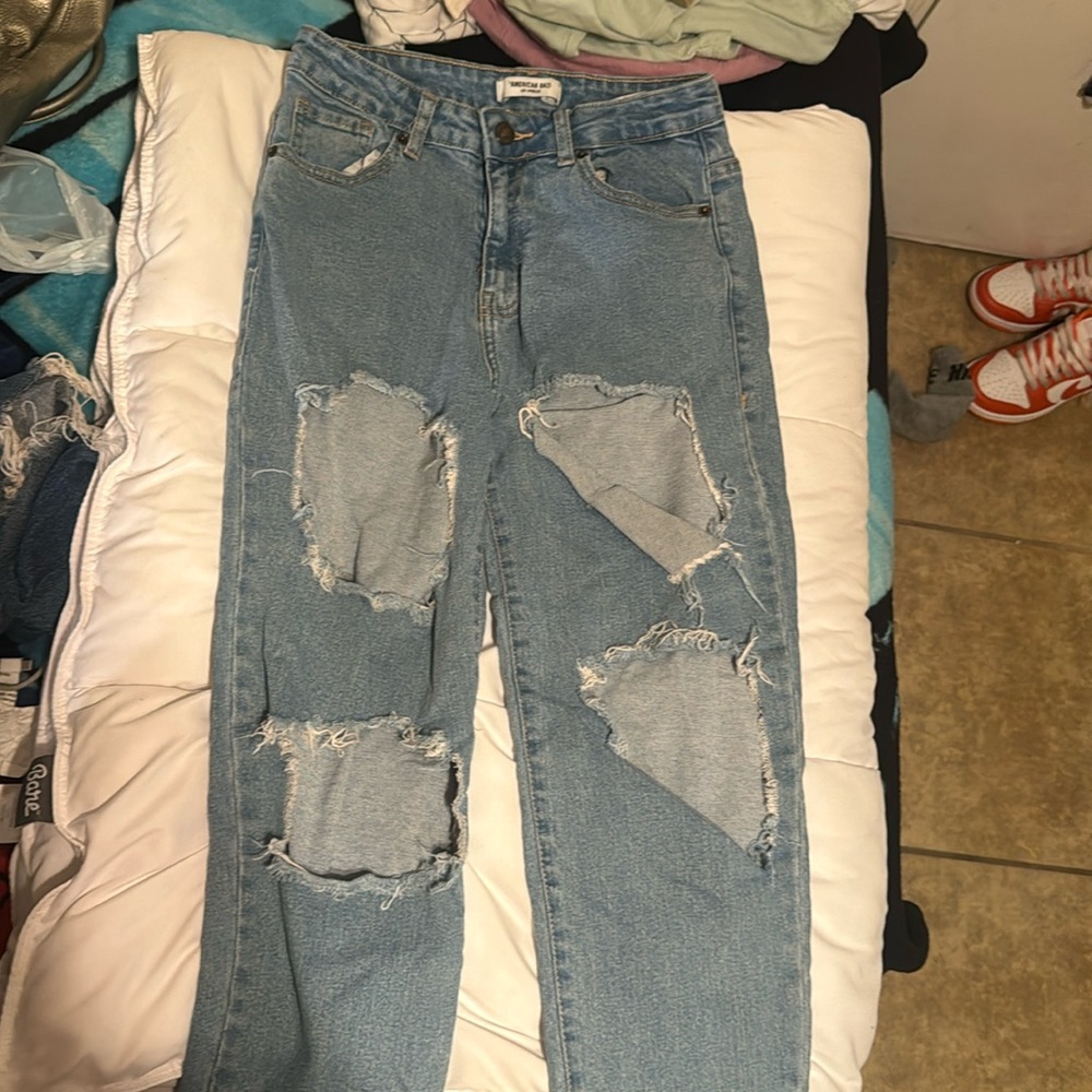Light blue ripped jeans
